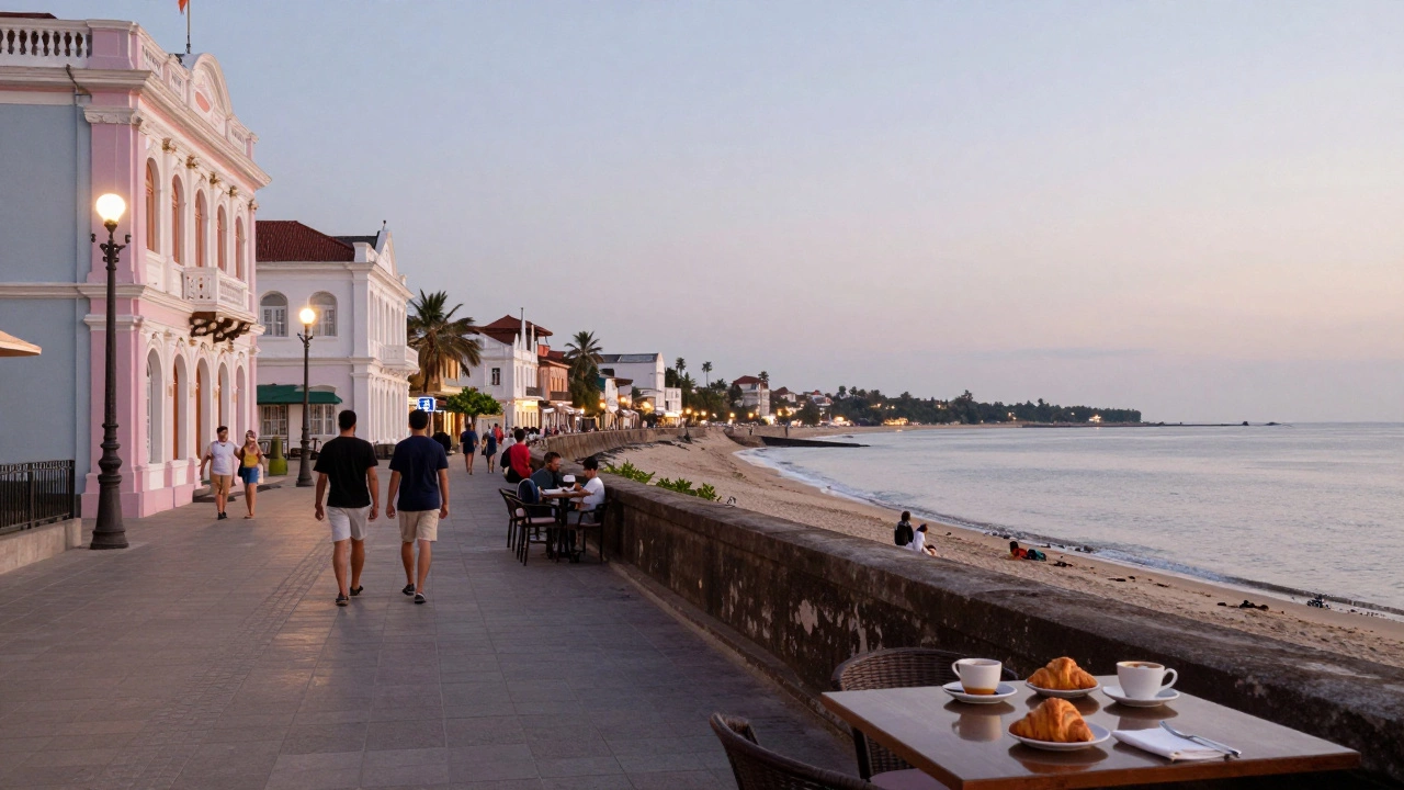 Puducherry promenade with colonial architecture and calm sea at dusk